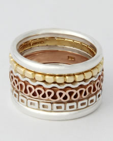 'A six bang Stacking Ring' muti patterned in mixed metals, no stones